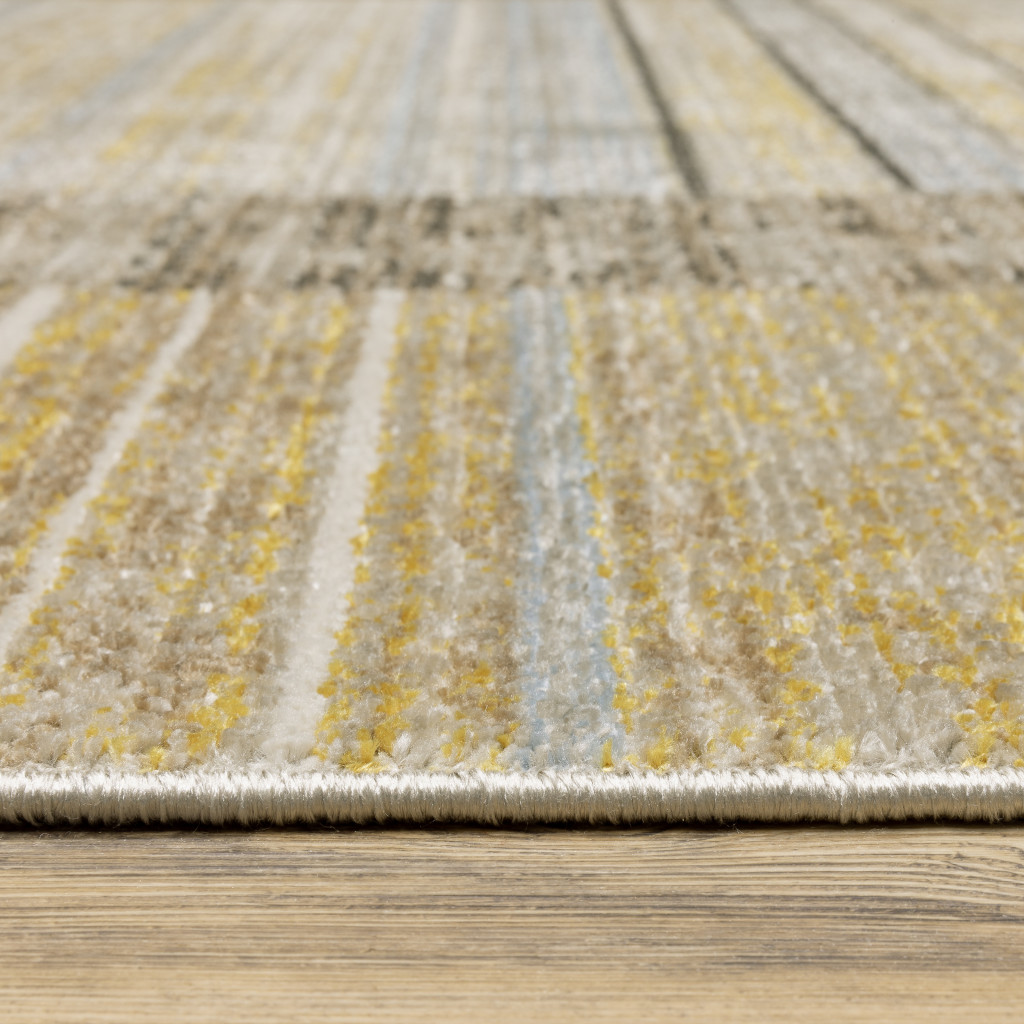 6" X 9" Beige Charcoal Brown Grey Tan Gold And Blue Geometric Power Loom Stain Resistant Area Rug With Fringe