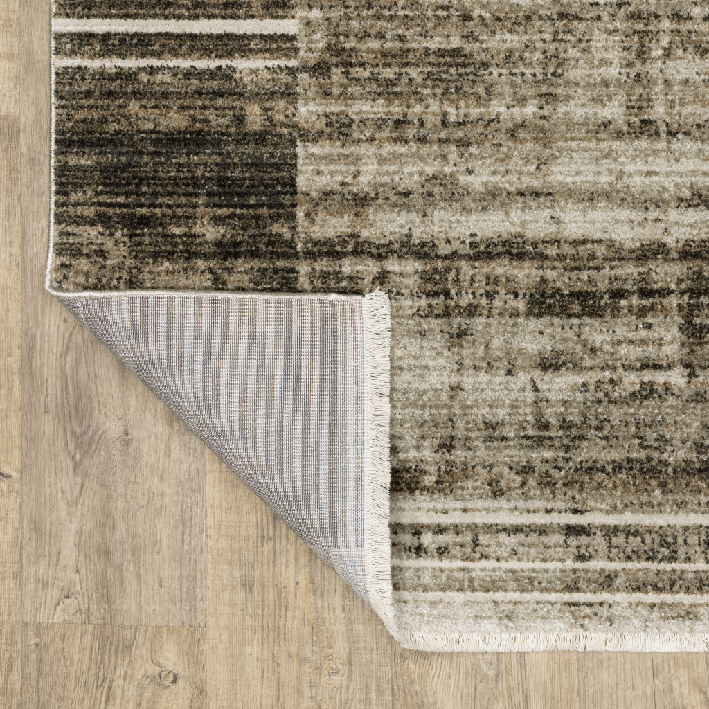 6" X 9" Beige Charcoal Brown Grey Tan Gold And Blue Geometric Power Loom Stain Resistant Area Rug With Fringe
