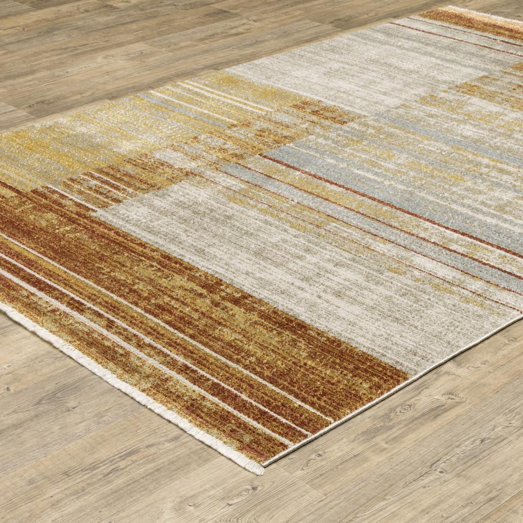 4" X 6" Rust Gold Blue Grey Ivory And Tan Geometric Power Loom Stain Resistant Area Rug With Fringe