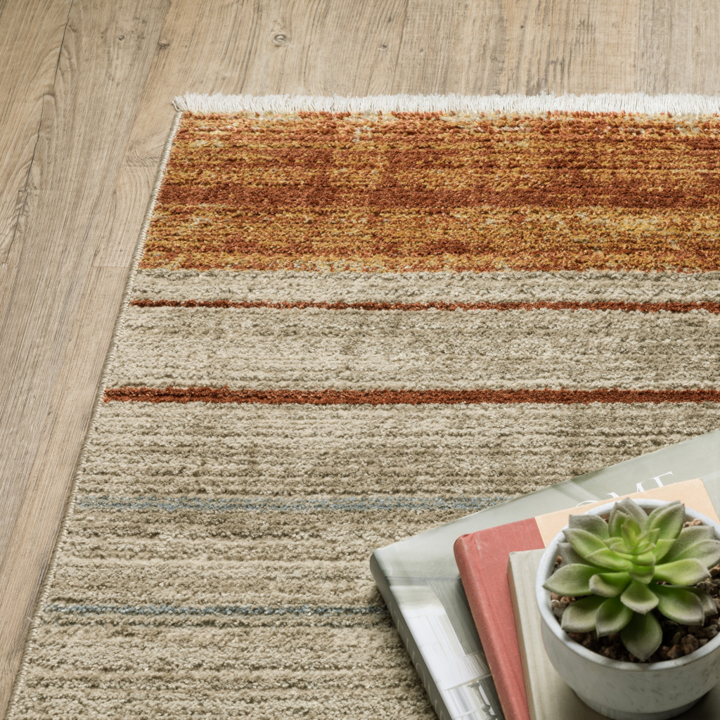 4" X 6" Rust Gold Blue Grey Ivory And Tan Geometric Power Loom Stain Resistant Area Rug With Fringe