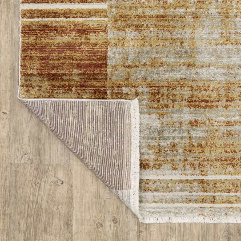 4" X 6" Rust Gold Blue Grey Ivory And Tan Geometric Power Loom Stain Resistant Area Rug With Fringe