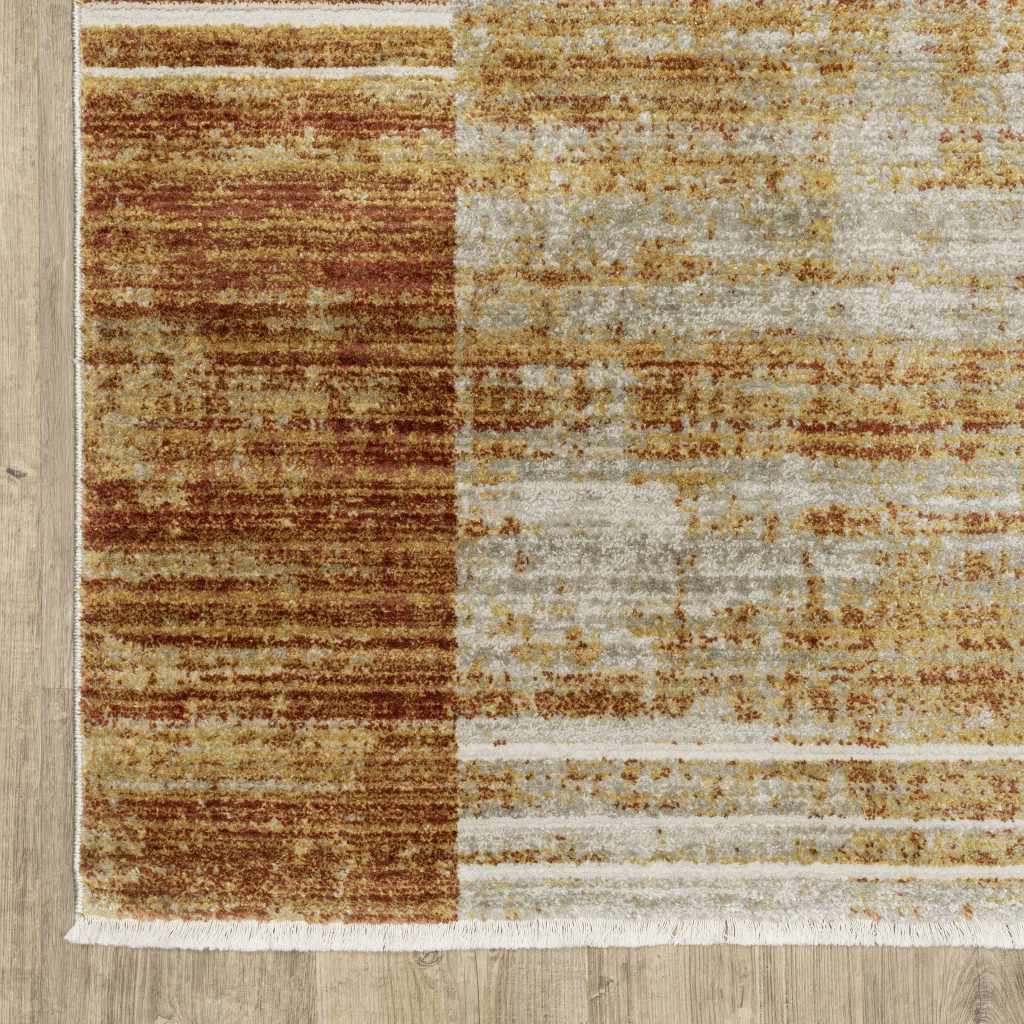 4" X 6" Rust Gold Blue Grey Ivory And Tan Geometric Power Loom Stain Resistant Area Rug With Fringe