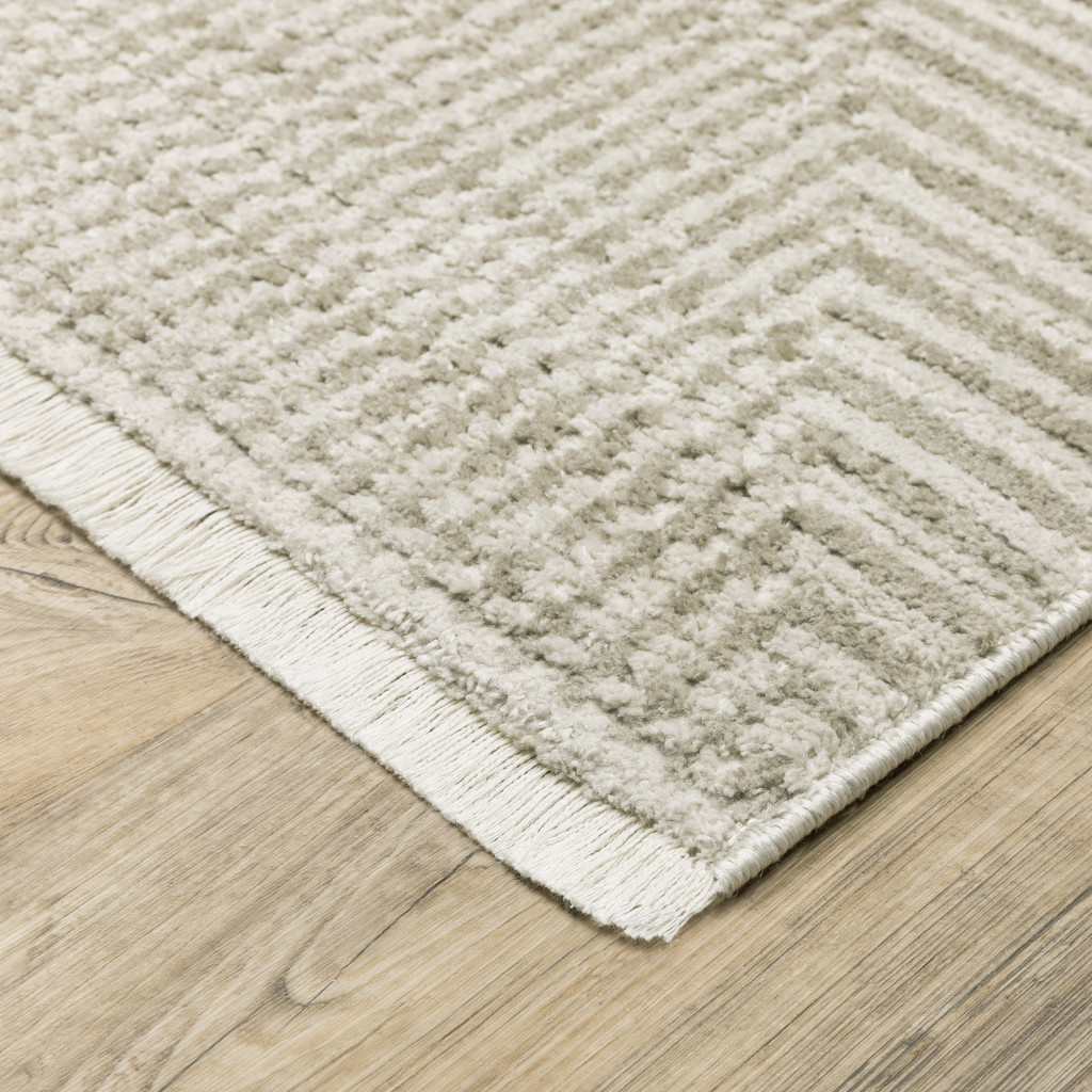 5" X 8" Ivory Beige Taupe And Tan Geometric Power Loom Stain Resistant Area Rug With Fringe