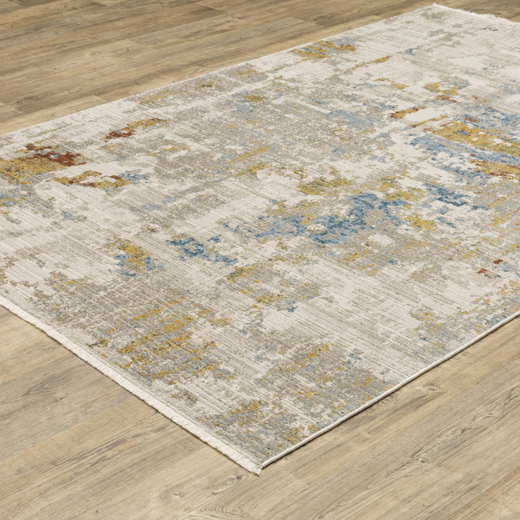 5" X 8" Beige Grey Gold Blue Rust And Teal Abstract Power Loom Stain Resistant Area Rug With Fringe