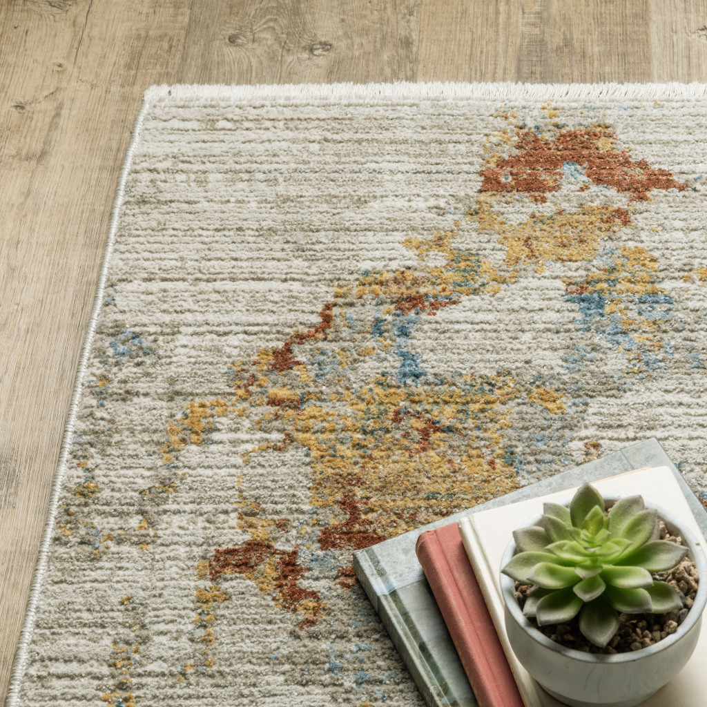 5" X 8" Beige Grey Gold Blue Rust And Teal Abstract Power Loom Stain Resistant Area Rug With Fringe