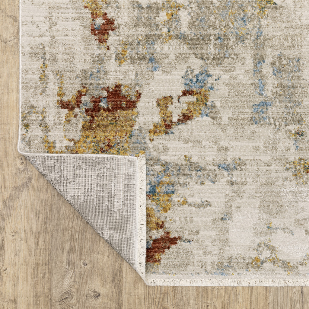 5" X 8" Beige Grey Gold Blue Rust And Teal Abstract Power Loom Stain Resistant Area Rug With Fringe