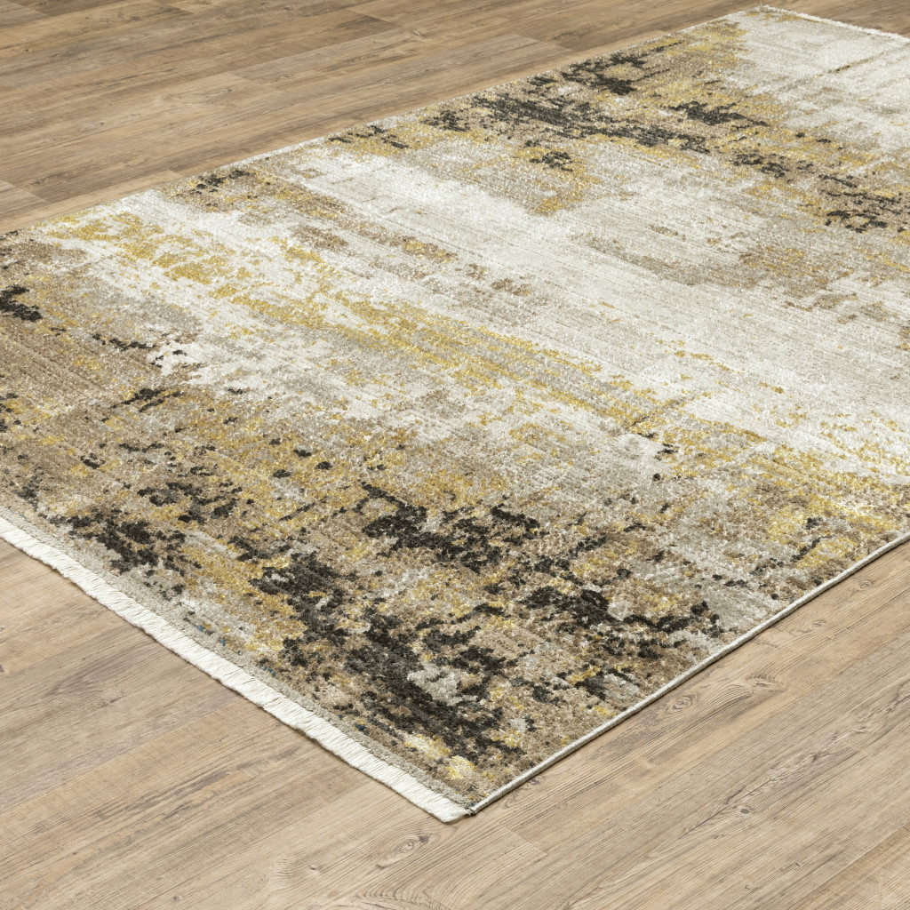 5" X 8" Grey Gold Black Charcoal And Beige Abstract Power Loom Stain Resistant Area Rug With Fringe