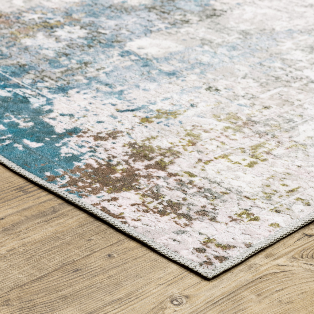 2" X 3" Ivory And Blue Abstract Printed Stain Resistant Non Skid Area Rug