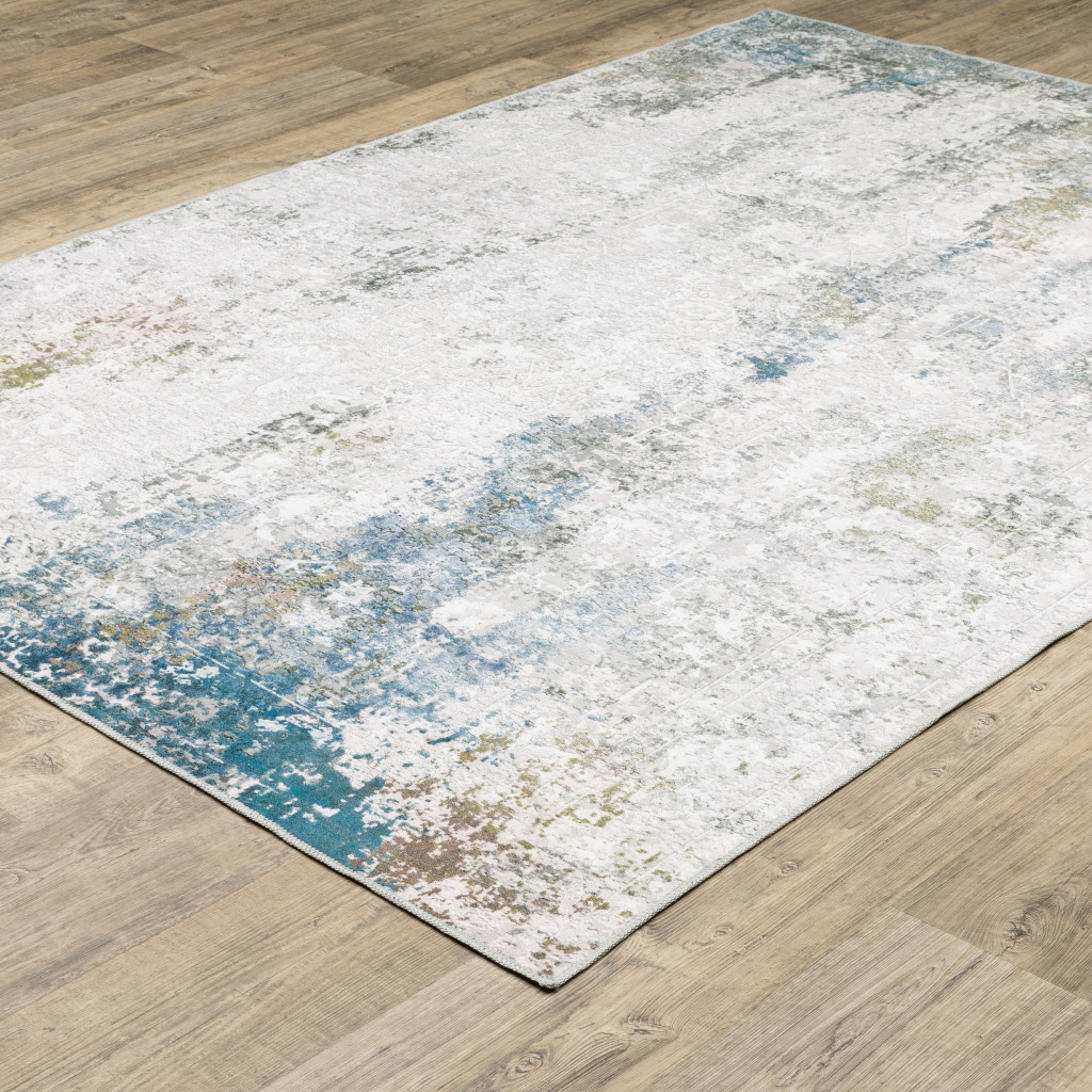 2" X 3" Ivory And Blue Abstract Printed Stain Resistant Non Skid Area Rug