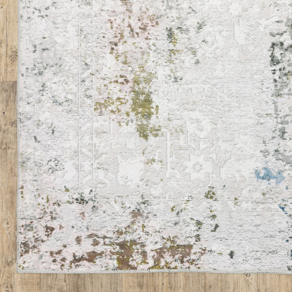 2" X 3" Ivory And Blue Abstract Printed Stain Resistant Non Skid Area Rug