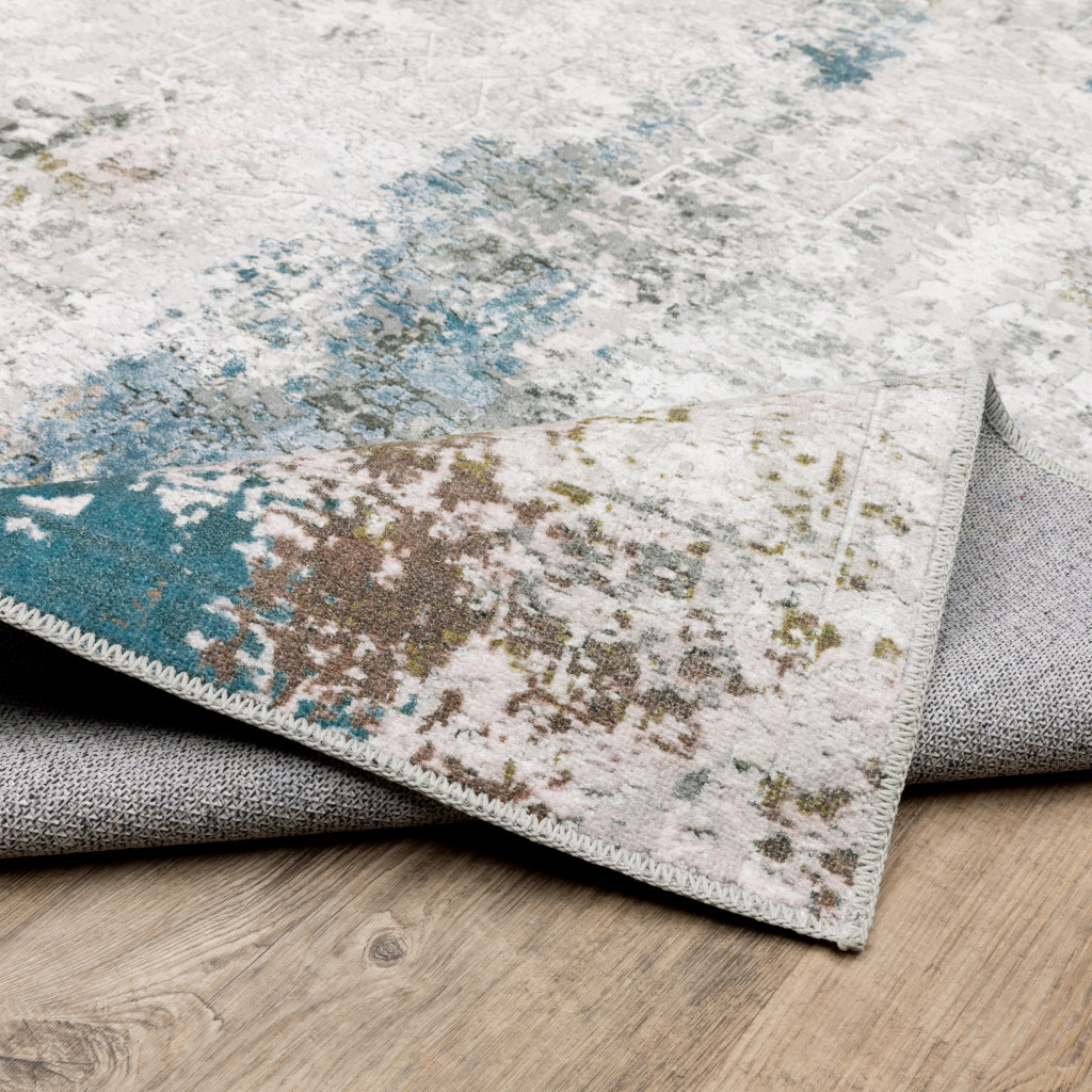 2" X 8" Ivory And Blue Abstract Printed Stain Resistant Non Skid Runner Rug
