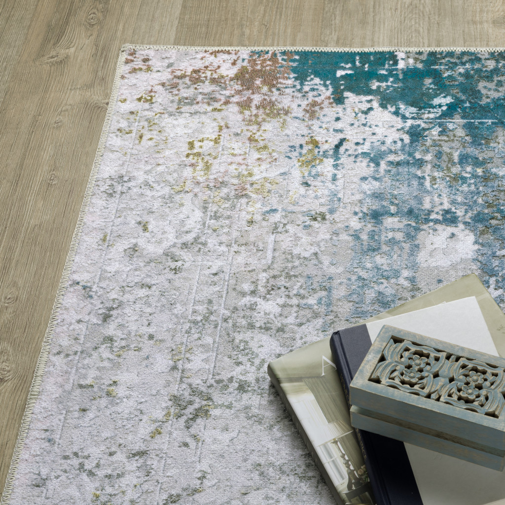 4" X 6" Ivory And Blue Abstract Printed Stain Resistant Non Skid Area Rug