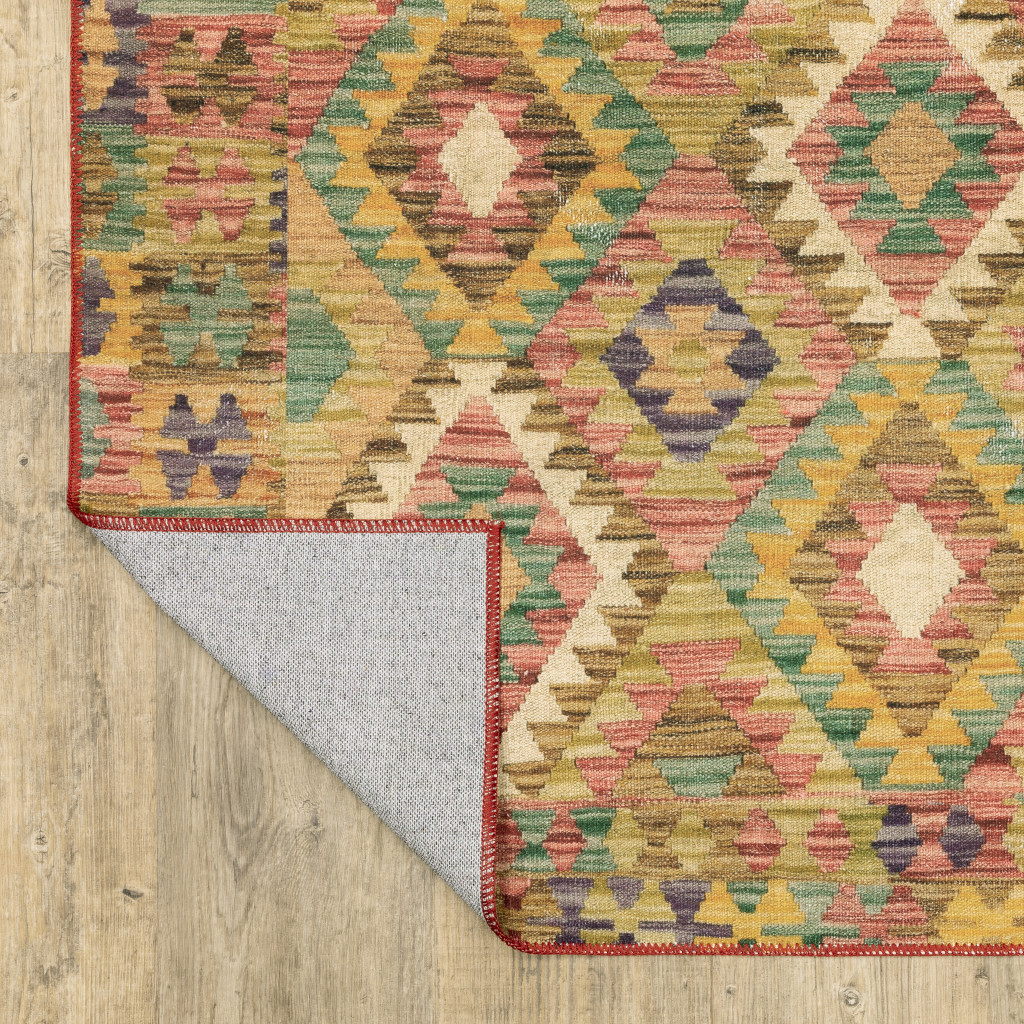 2" X 3" Gold Orange Brown Red Green Purple And Beige Southwestern Printed Stain Resistant Non Skid Area Rug