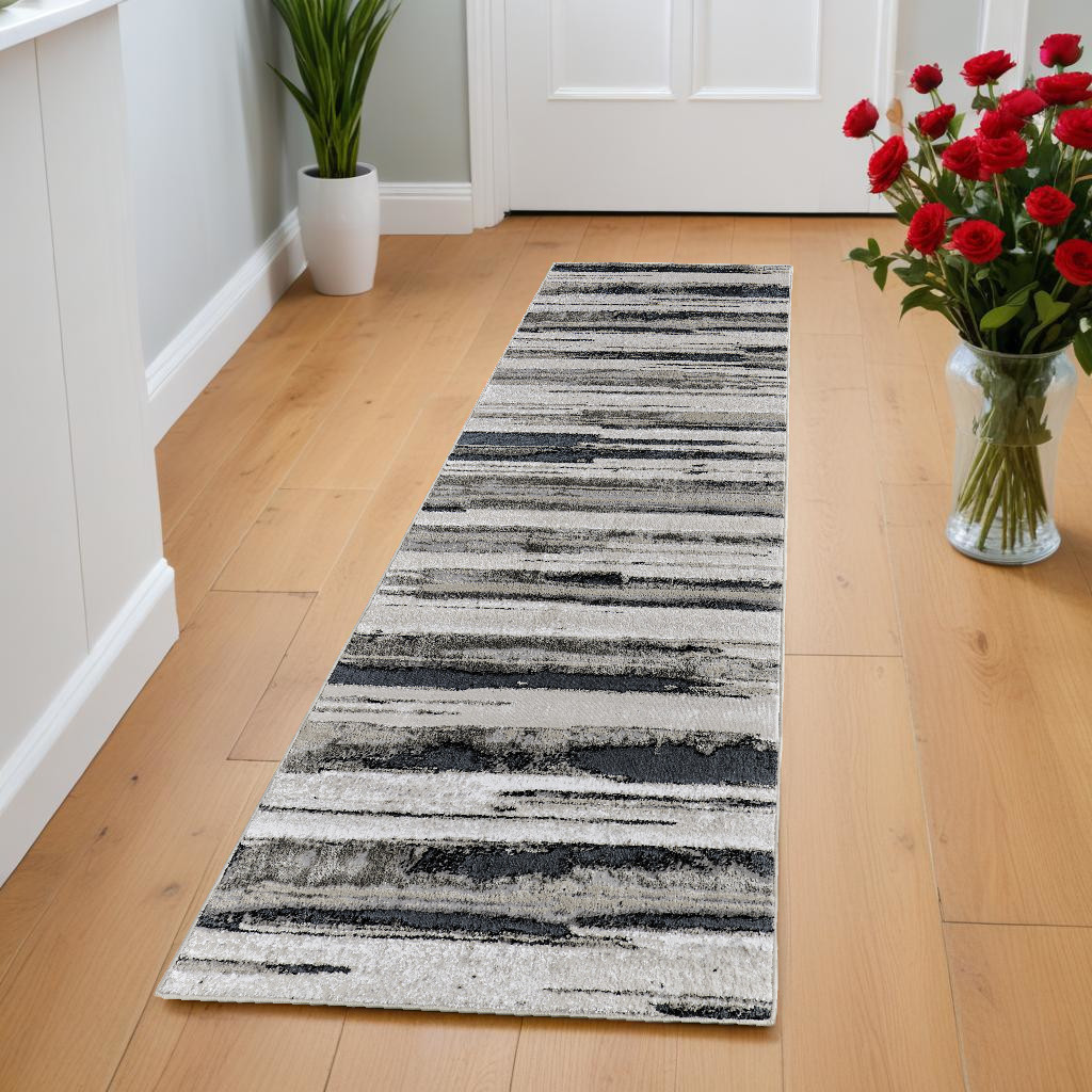 8" Beige and Black Abstract Distressed Runner Rug