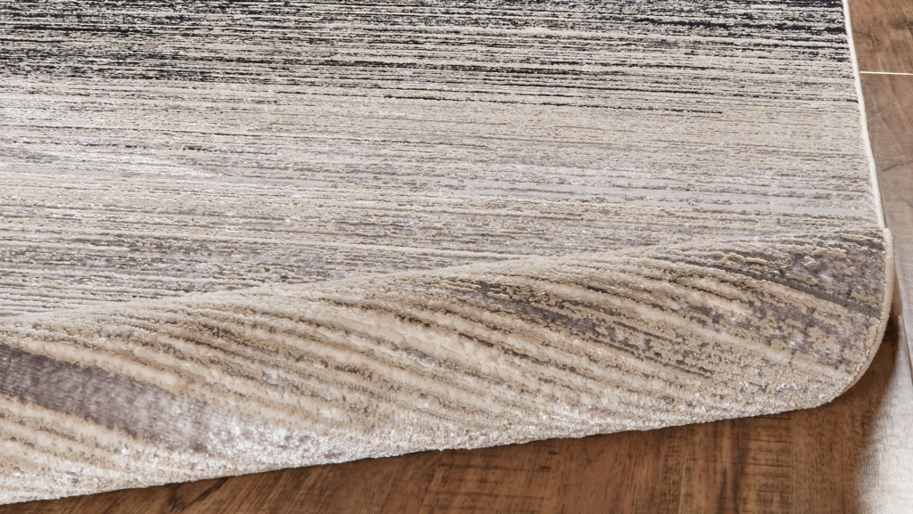 5" X 8" Beige and Black Abstract Non Skid Area Rug
