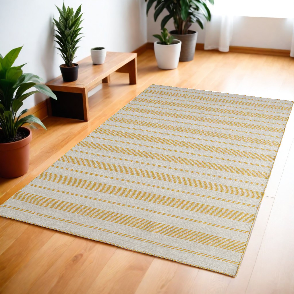 4" X 6" Yellow And Ivory Striped Dhurrie Hand Woven Stain Resistant Area Rug