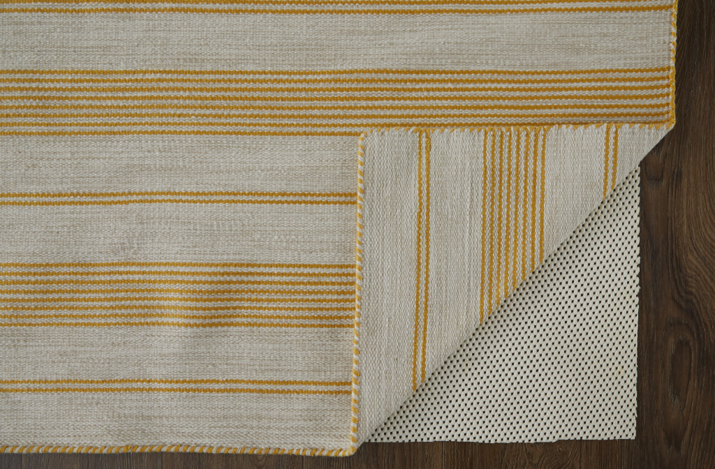 5" X 8" Yellow And Ivory Striped Dhurrie Hand Woven Stain Resistant Area Rug