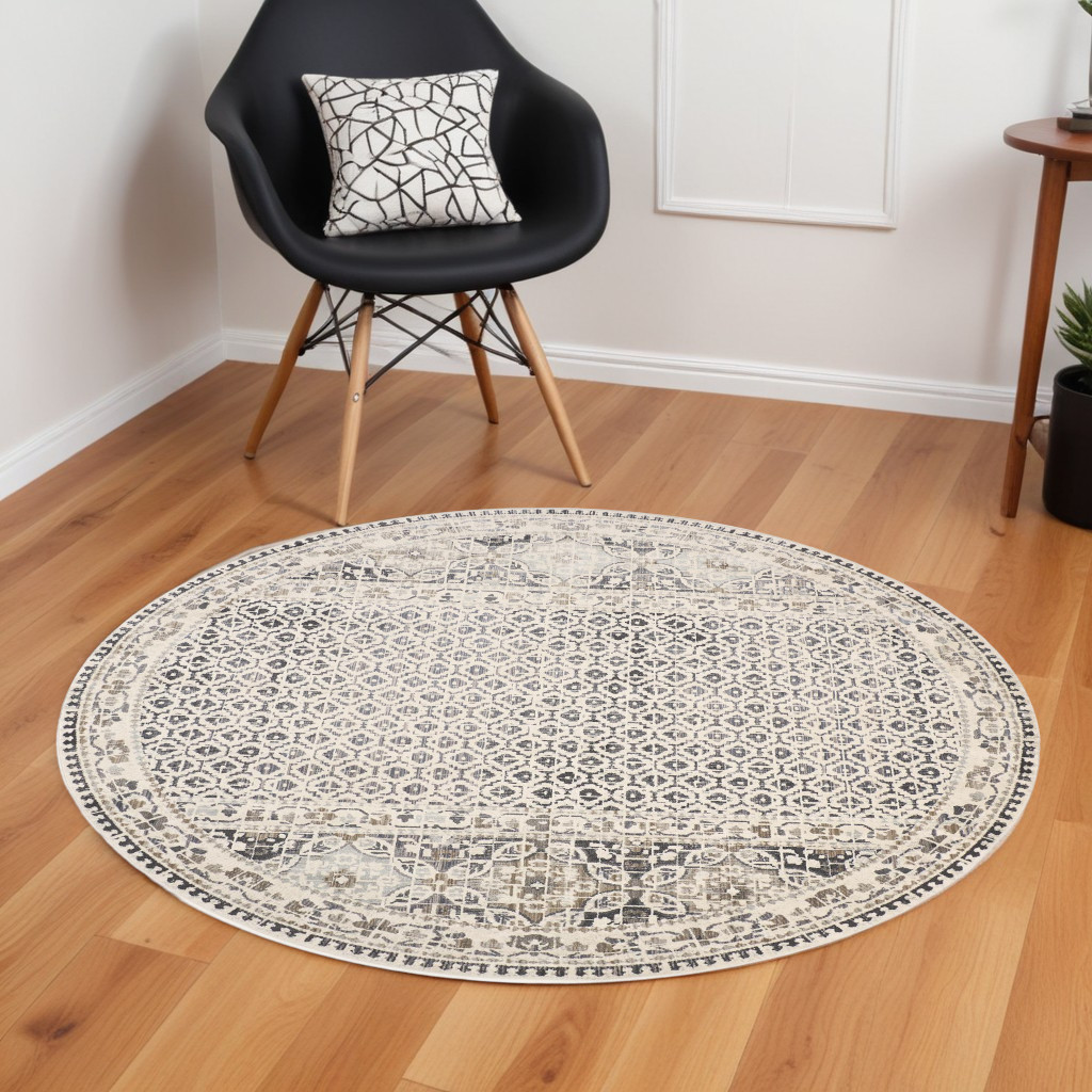 9" Ivory and Black Round Abstract Area Rug