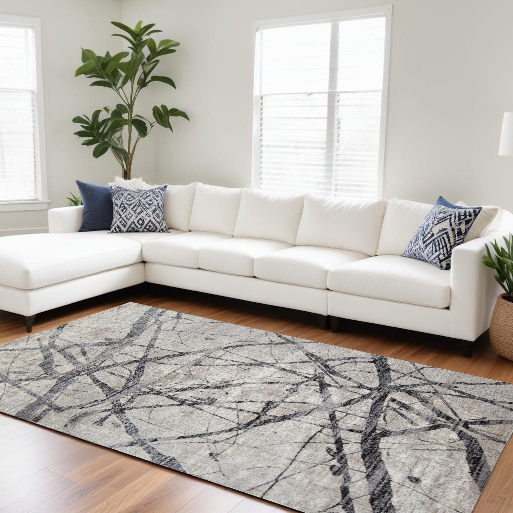 7" X 10" Taupe Gray And Ivory Abstract Stain Resistant Area Rug