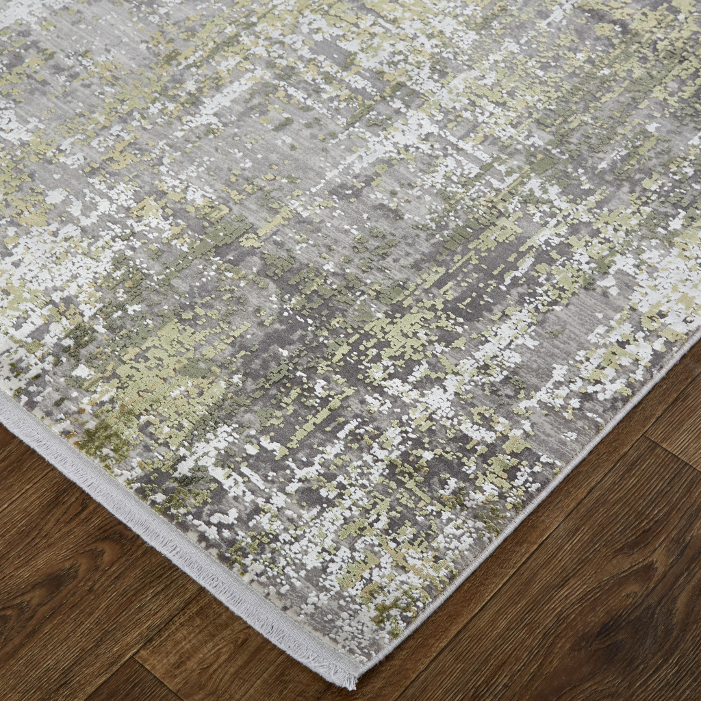 8" X 11" Green Gray And Ivory Abstract Area Rug With Fringe
