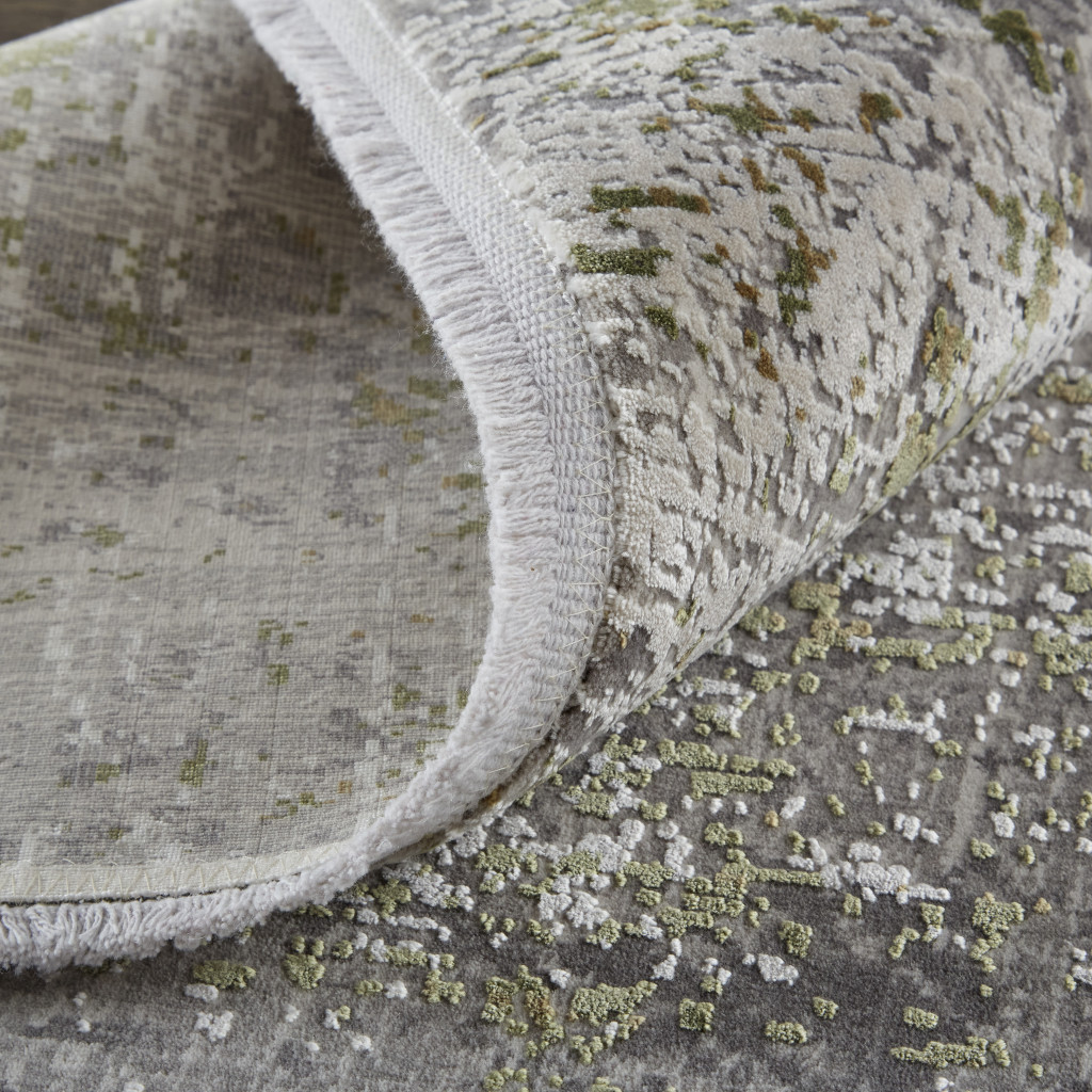 8" X 11" Green Gray And Ivory Abstract Area Rug With Fringe