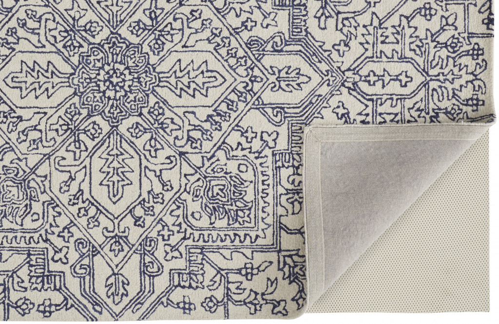 5" X 8" Ivory And Navy Wool Floral Tufted Handmade Stain Resistant Area Rug