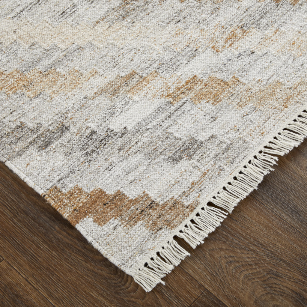 5 X 8 Ivory gray And Tan geometric Hand Woven Stain Resistant Area Rug With Fringe