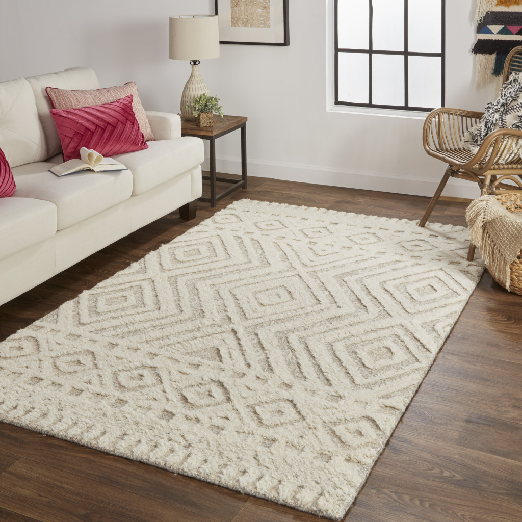 5" X 8" Ivory And Tan Wool Geometric Tufted Handmade Stain Resistant Area Rug