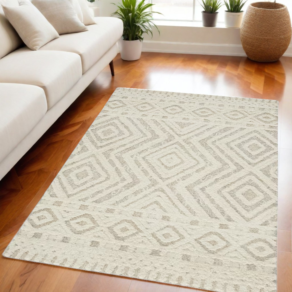 5" X 8" Ivory And Tan Wool Geometric Tufted Handmade Stain Resistant Area Rug