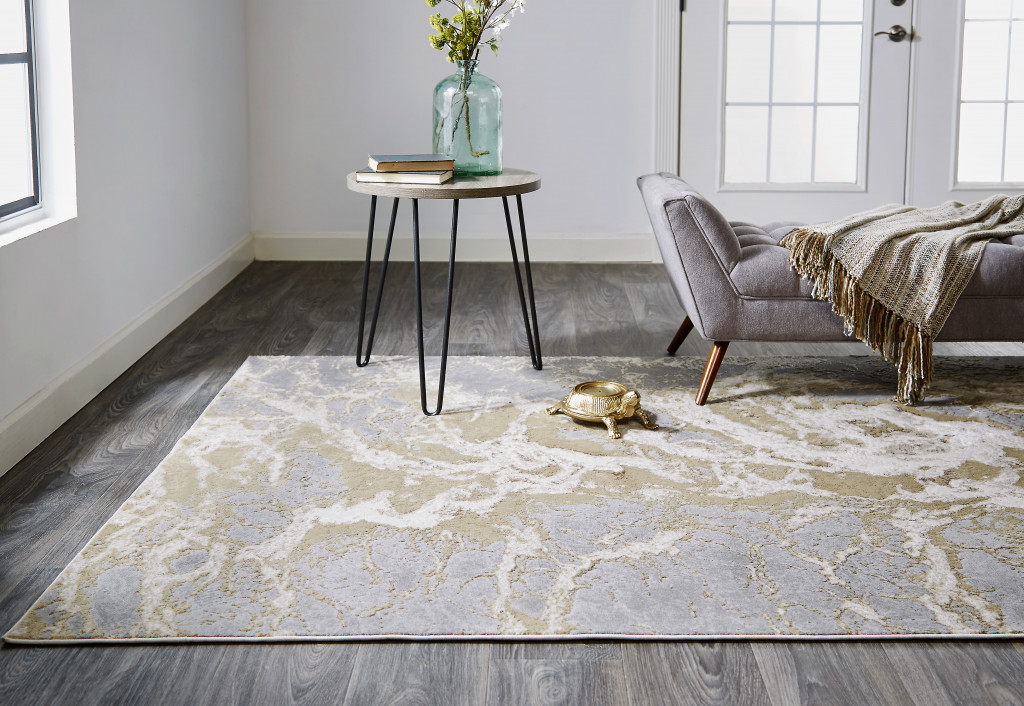 7" X 10" Ivory Silver And Gold Abstract Stain Resistant Area Rug