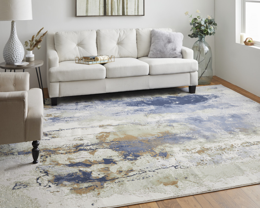 9" X 12" Blue Orange And Ivory Abstract Power Loom Area Rug