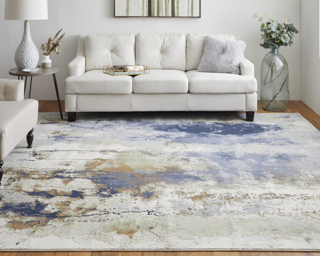 9" X 12" Blue Orange And Ivory Abstract Power Loom Area Rug