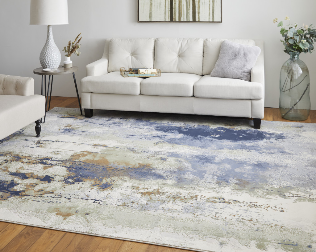 9" X 12" Blue Orange And Ivory Abstract Power Loom Area Rug