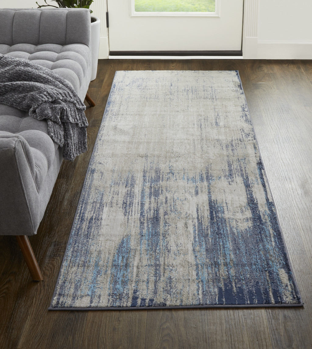 8" Tan Blue And Ivory Abstract Power Loom Distressed Runner Rug