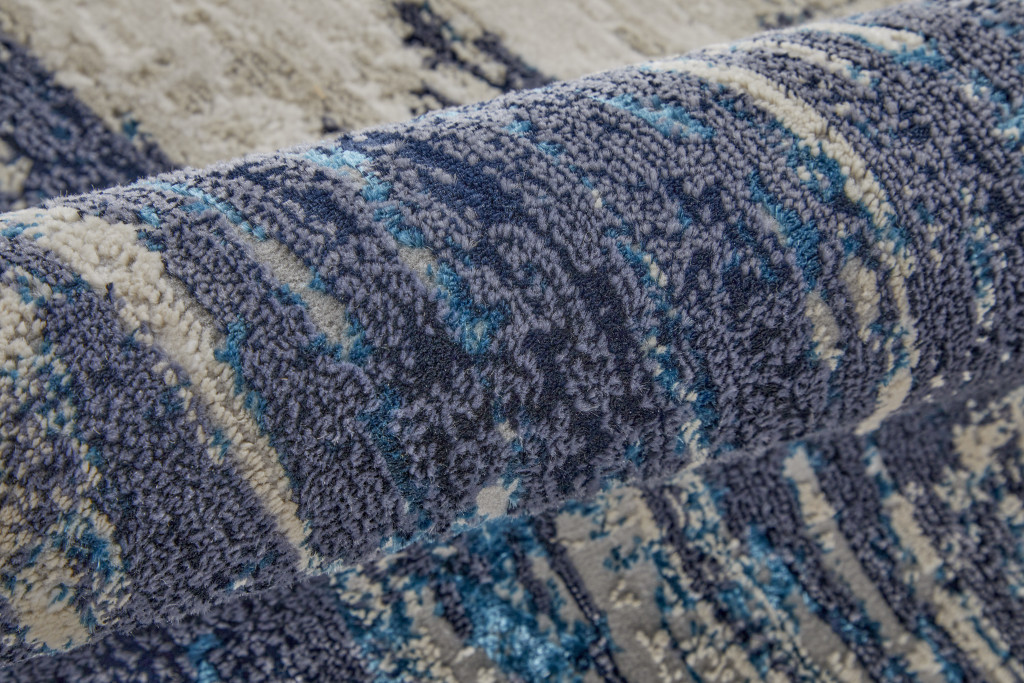 8" Tan Blue And Ivory Abstract Power Loom Distressed Runner Rug