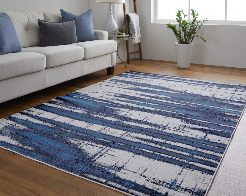 9" X 12" Ivory Blue And Gray Abstract Power Loom Distressed Area Rug