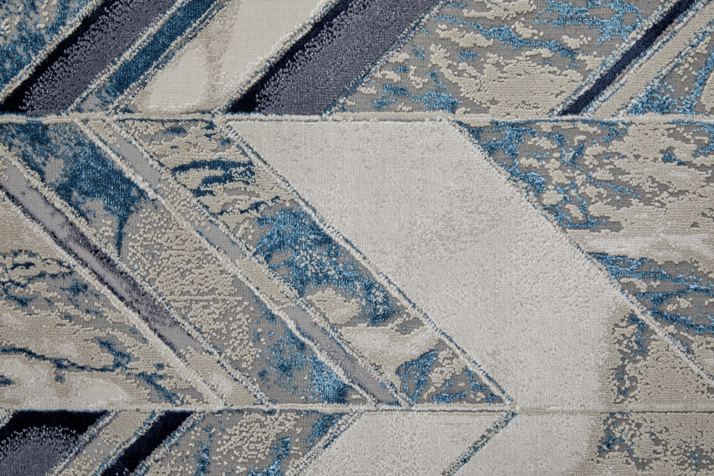 9" X 12" Ivory Blue And Gray Chevron Power Loom Distressed Area Rug