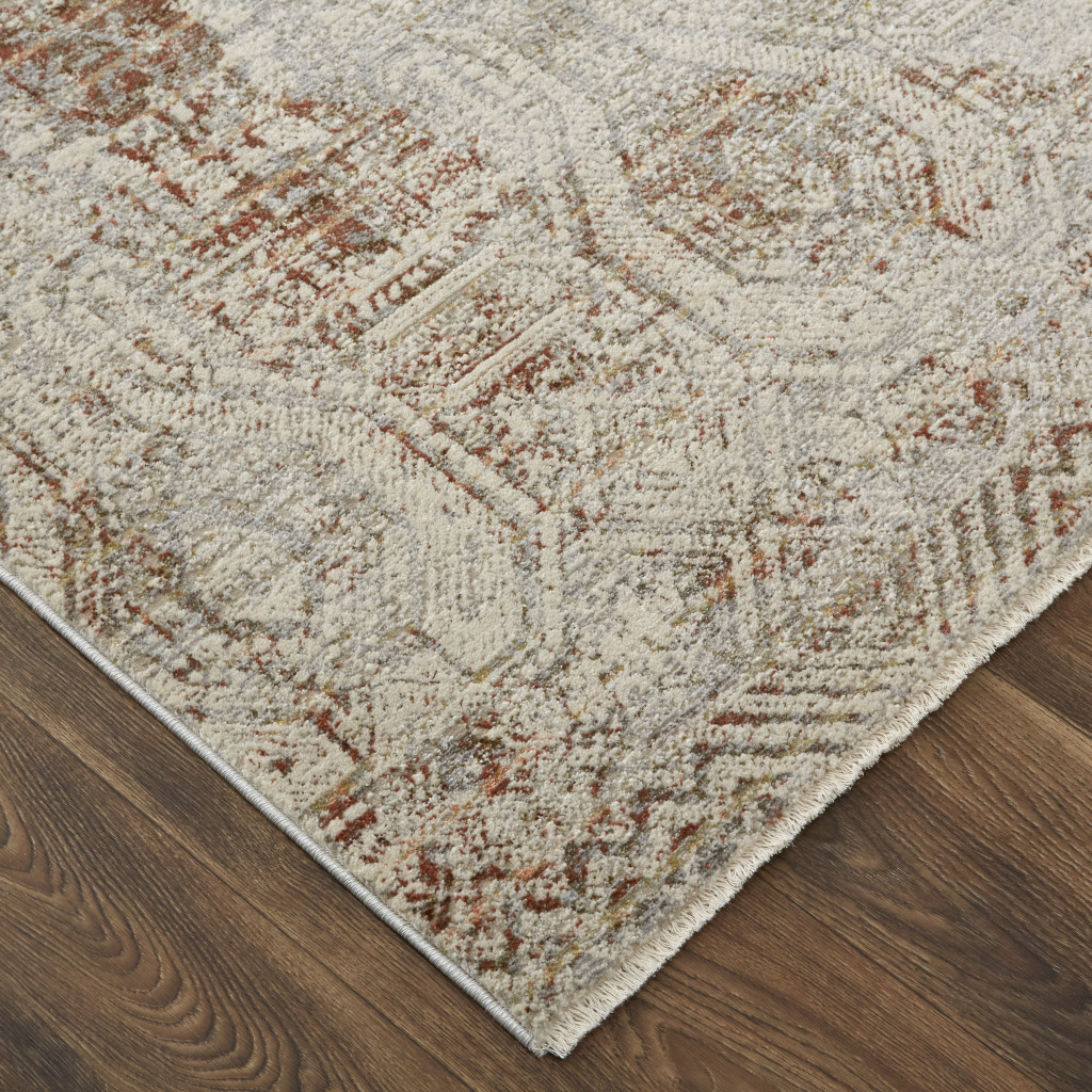 10" X 13" Tan Ivory And Orange Floral Power Loom Distressed Area Rug With Fringe