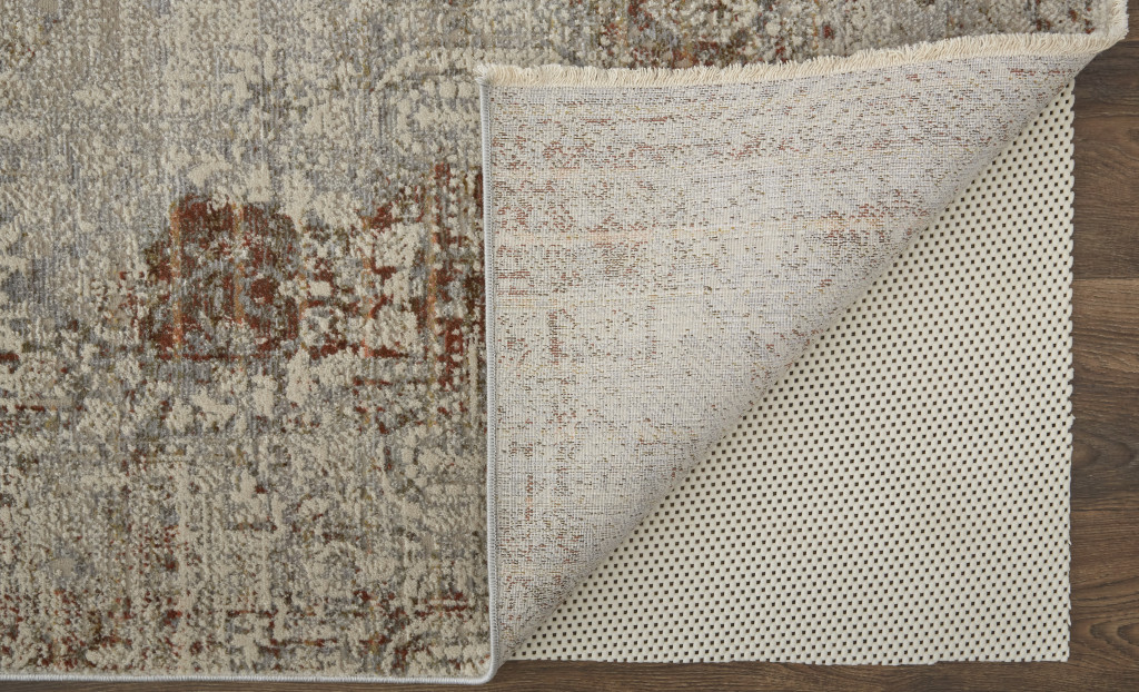 10" X 13" Tan Ivory And Orange Floral Power Loom Distressed Area Rug With Fringe