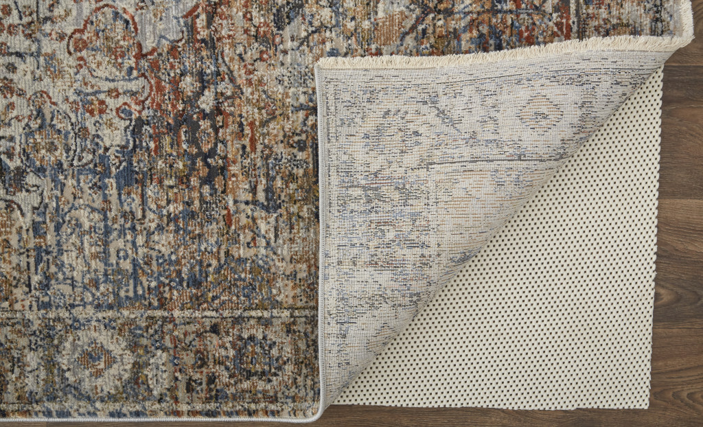 2" X 3" Tan Orange And Blue Floral Power Loom Distressed Area Rug With Fringe