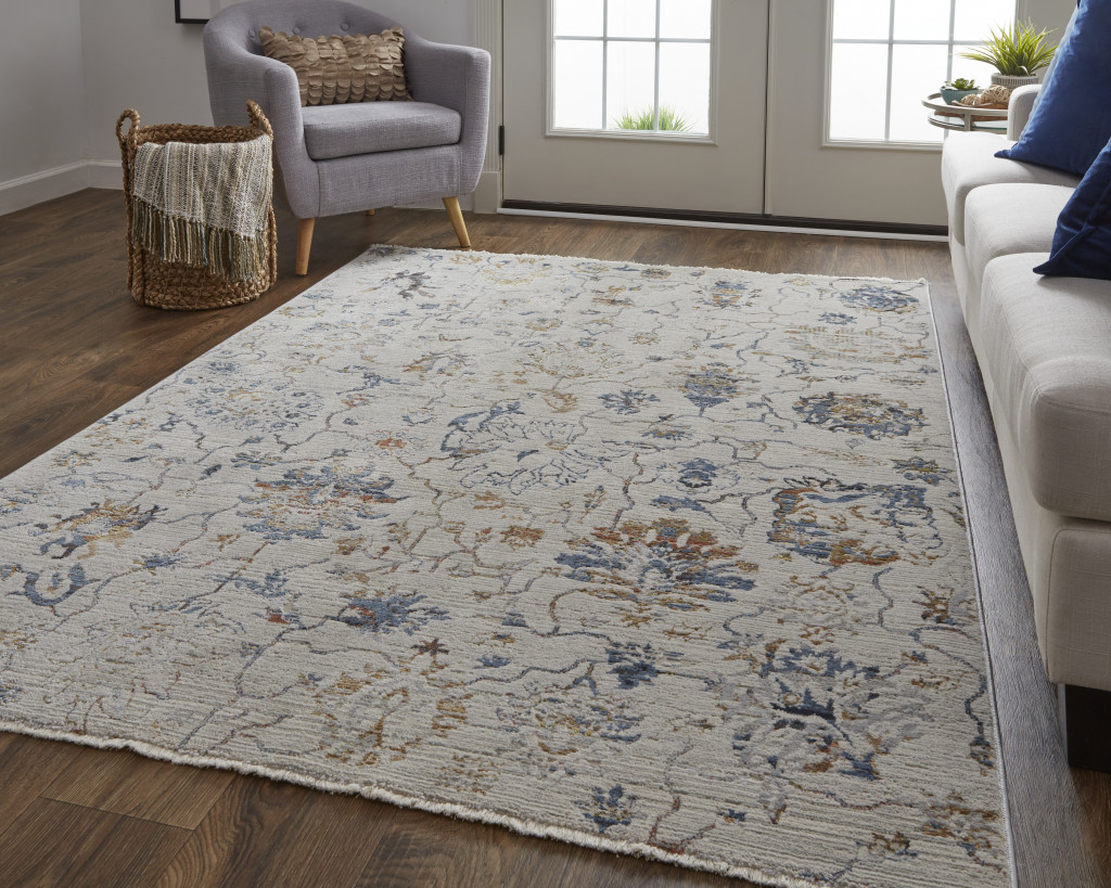 10" X 13" Ivory Orange And Blue Floral Power Loom Distressed Area Rug With Fringe