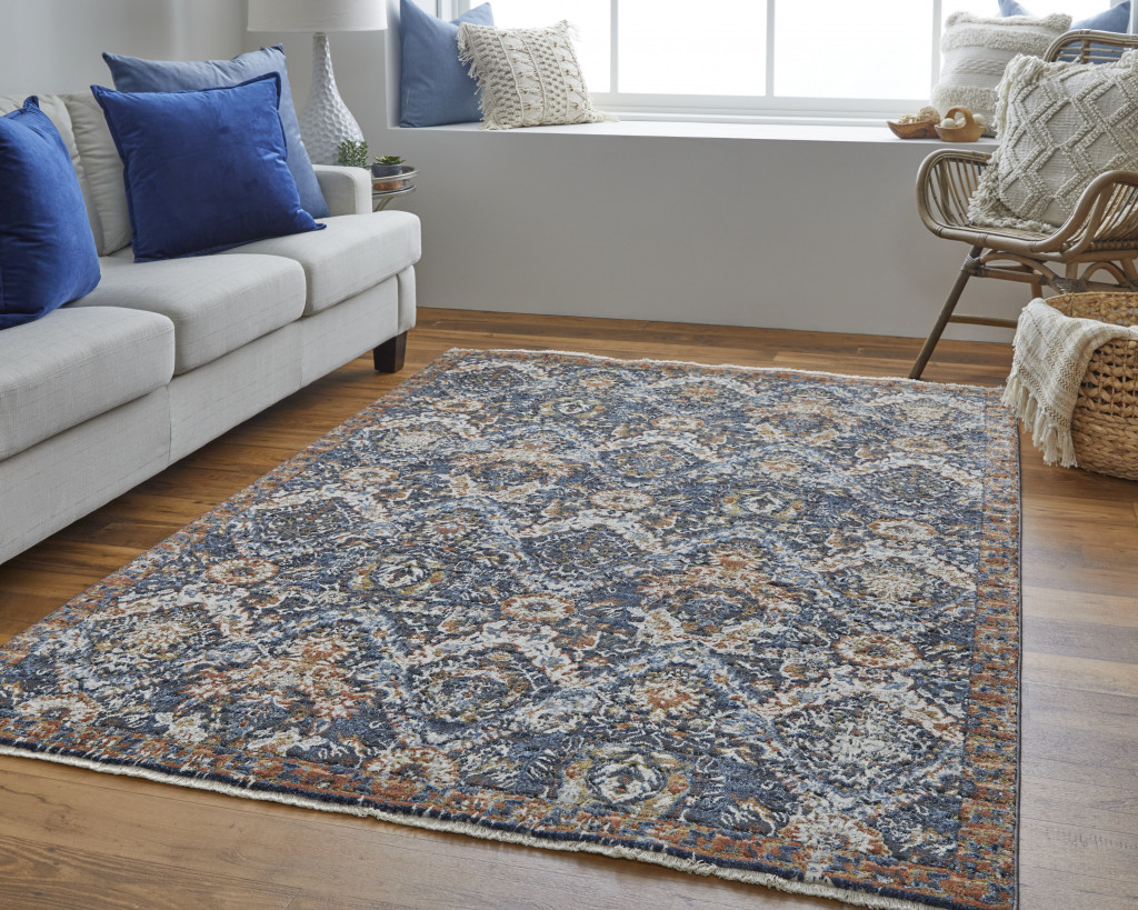 10" X 13" Blue Orange And Ivory Floral Power Loom Area Rug With Fringe