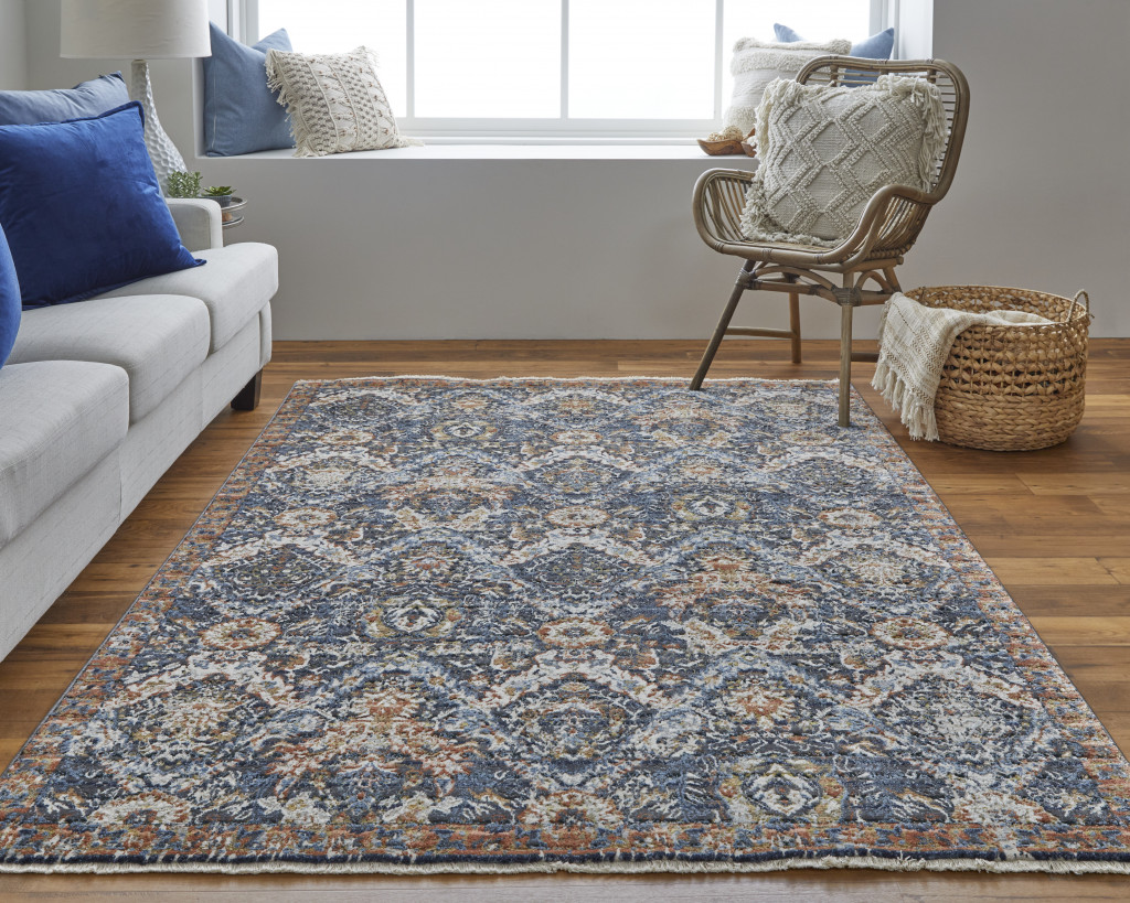 10" X 13" Blue Orange And Ivory Floral Power Loom Area Rug With Fringe