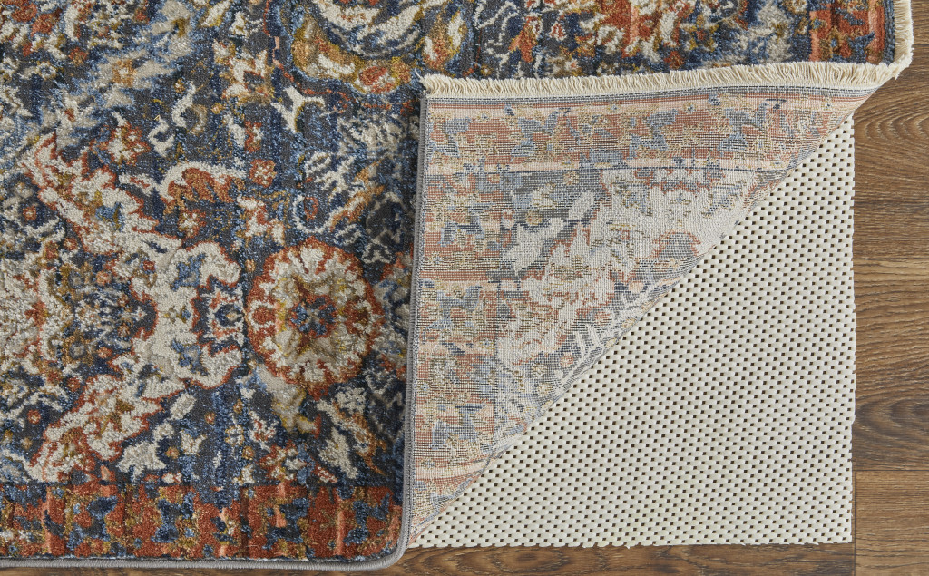 10" X 13" Blue Orange And Ivory Floral Power Loom Area Rug With Fringe