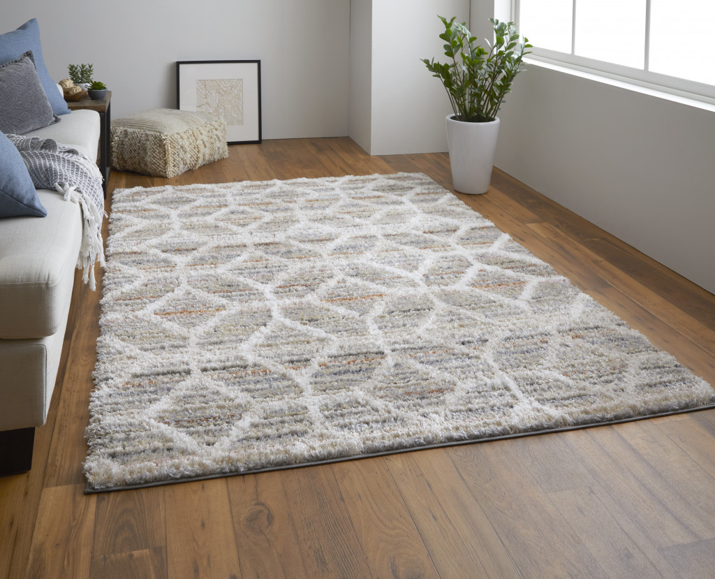 2" X 3" Tan Taupe And Ivory Geometric Power Loom Stain Resistant Area Rug