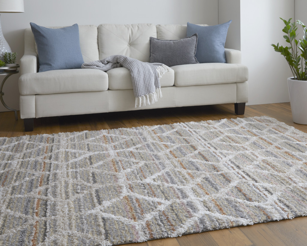 2" X 3" Tan Taupe And Ivory Geometric Power Loom Stain Resistant Area Rug