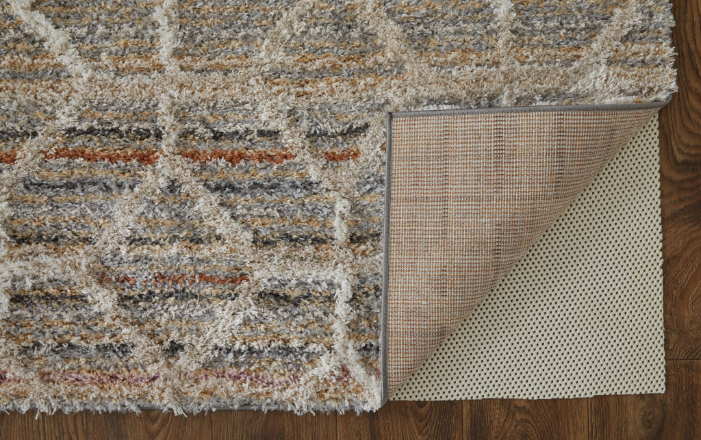 2" X 3" Tan Taupe And Ivory Geometric Power Loom Stain Resistant Area Rug