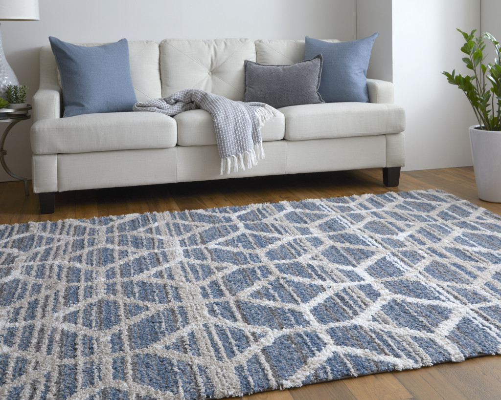 5" X 8" Blue And Ivory Geometric Power Loom Stain Resistant Area Rug