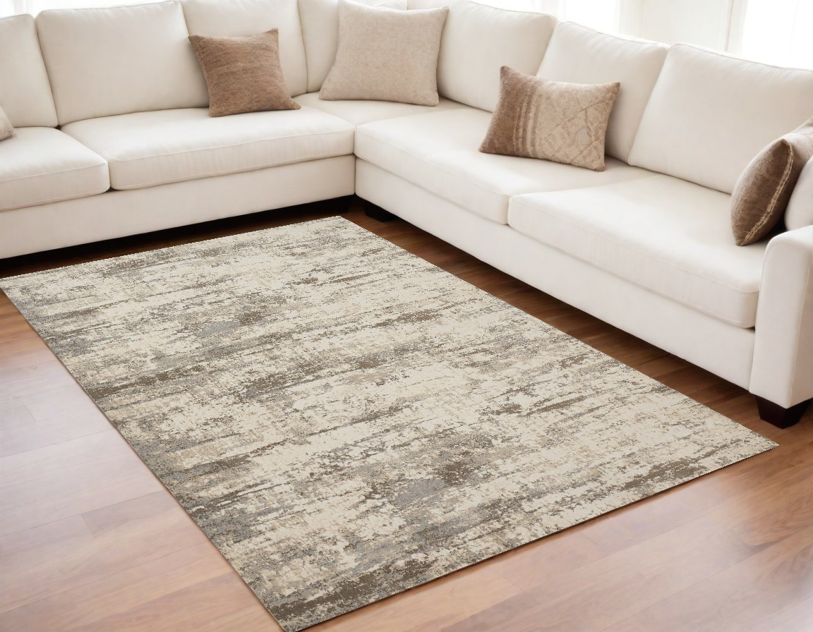 5" X 8" Ivory And Brown Abstract Area Rug