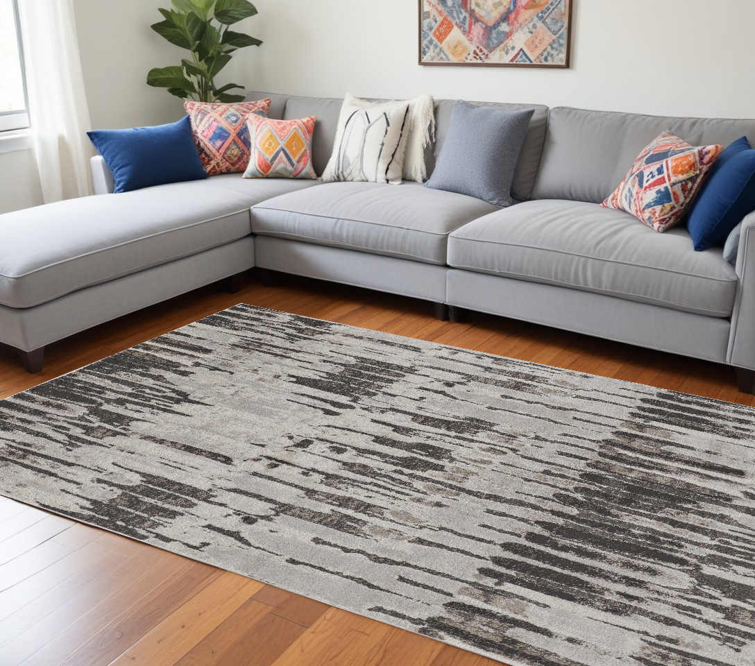 7" X 10" Gray and Ivory Abstract Power Loom Area Rug